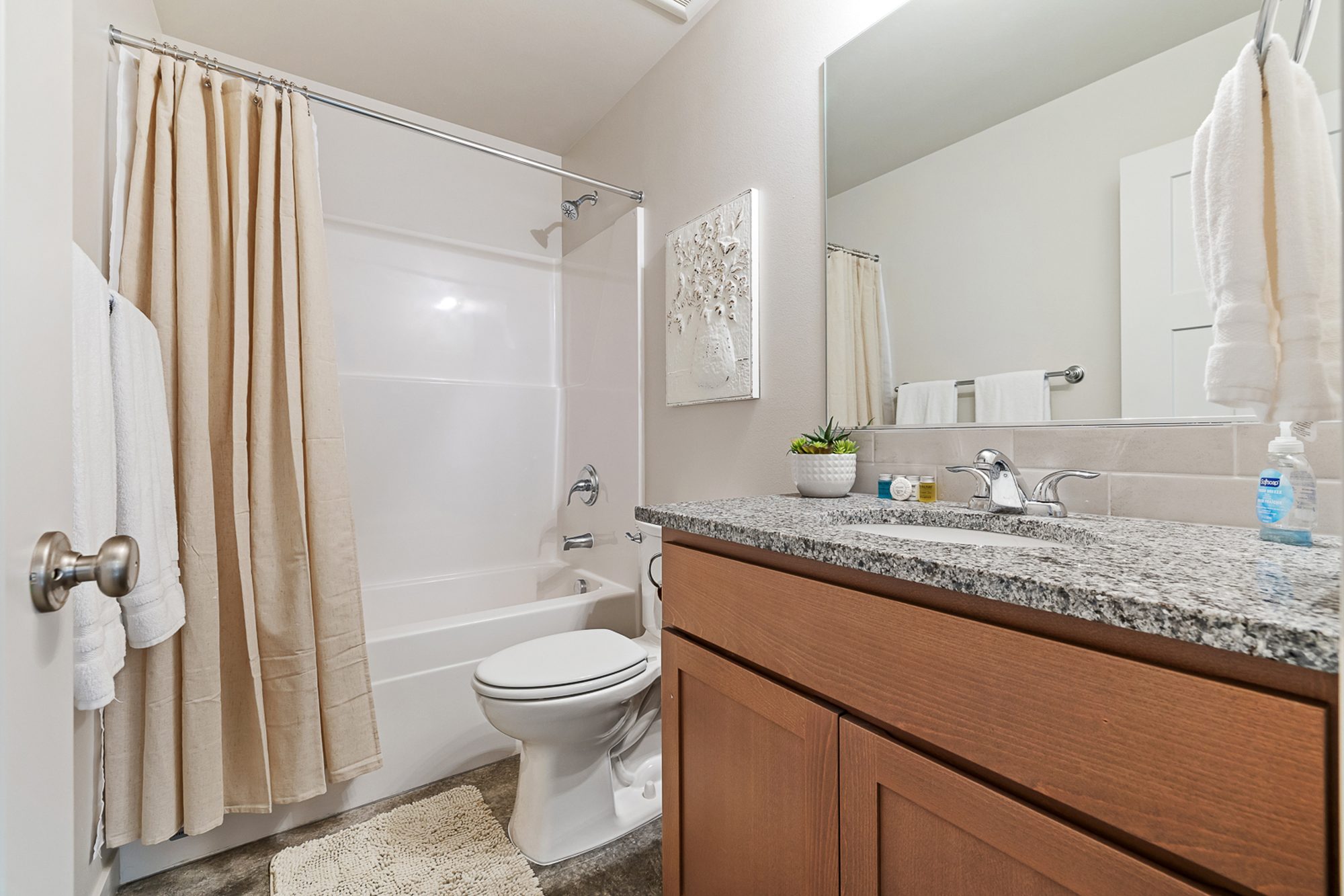 Main bathroom in a three bedroom, two bath Olin Homes home at 715 Tinley St