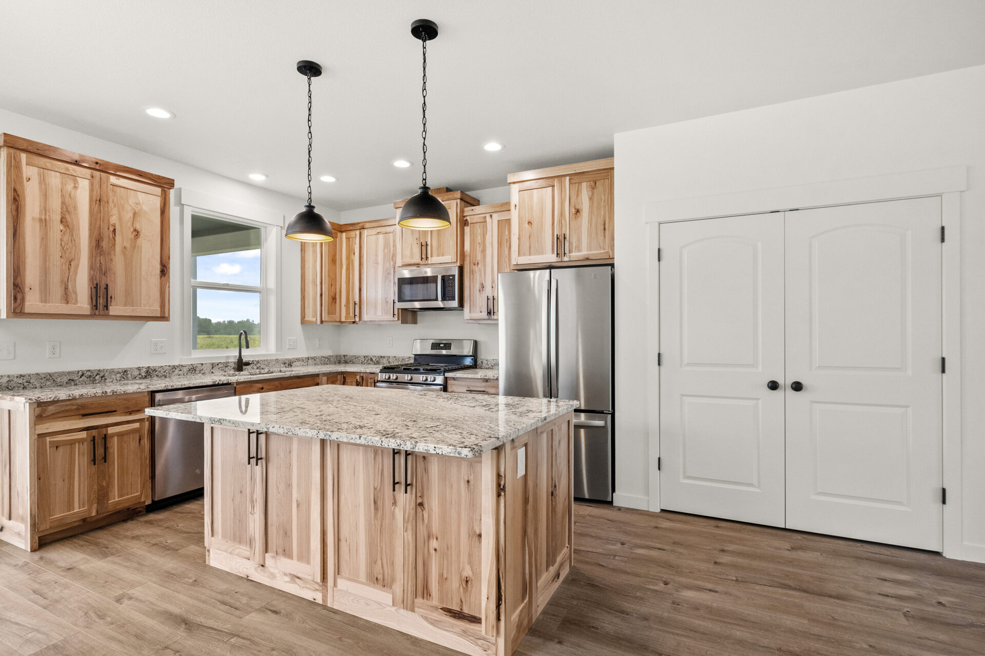 Kitchen island and cabinets at 230 Stirling Loop