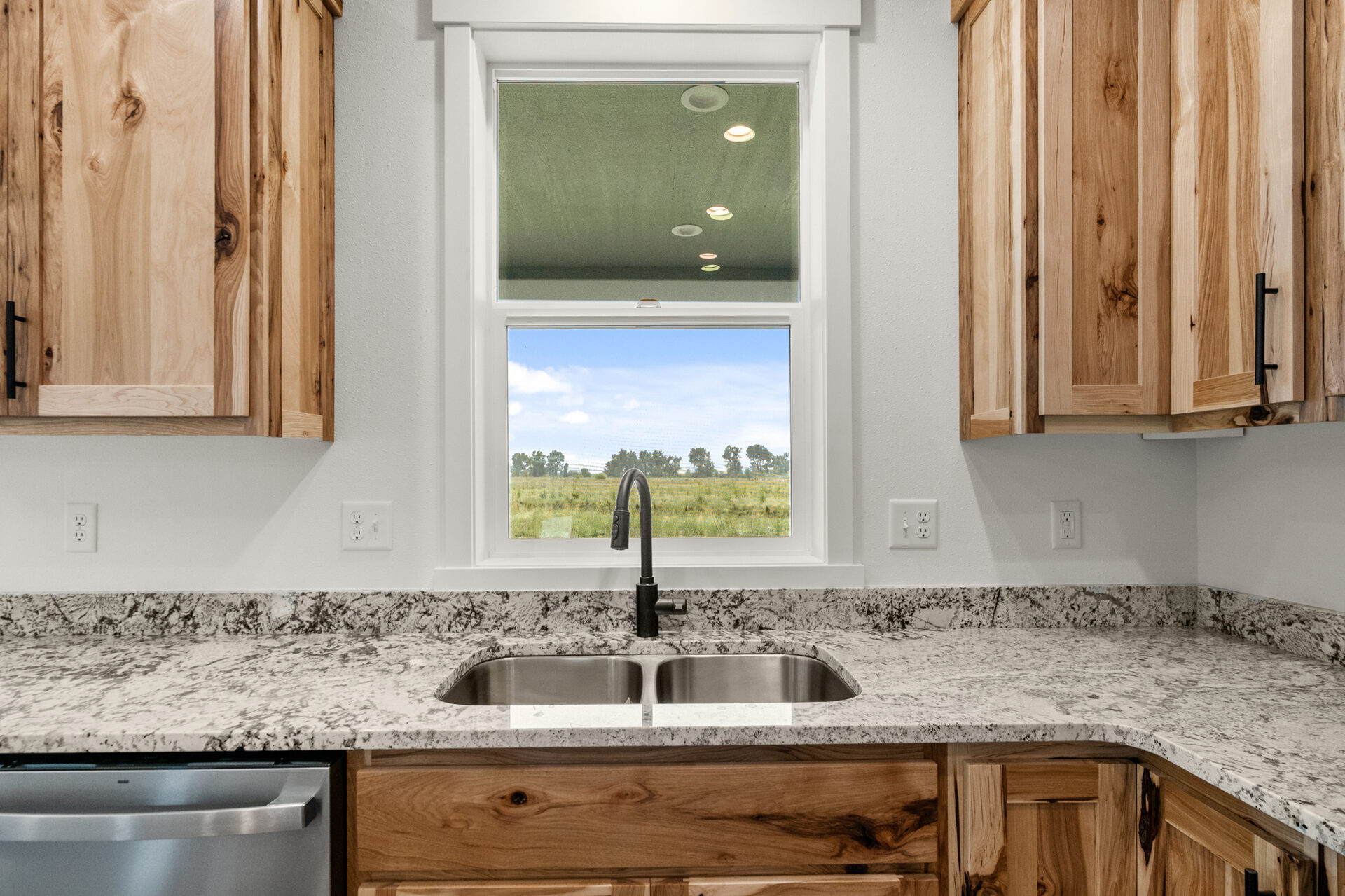 Kitchen sink and cabinets at 230 Stirling Loop
