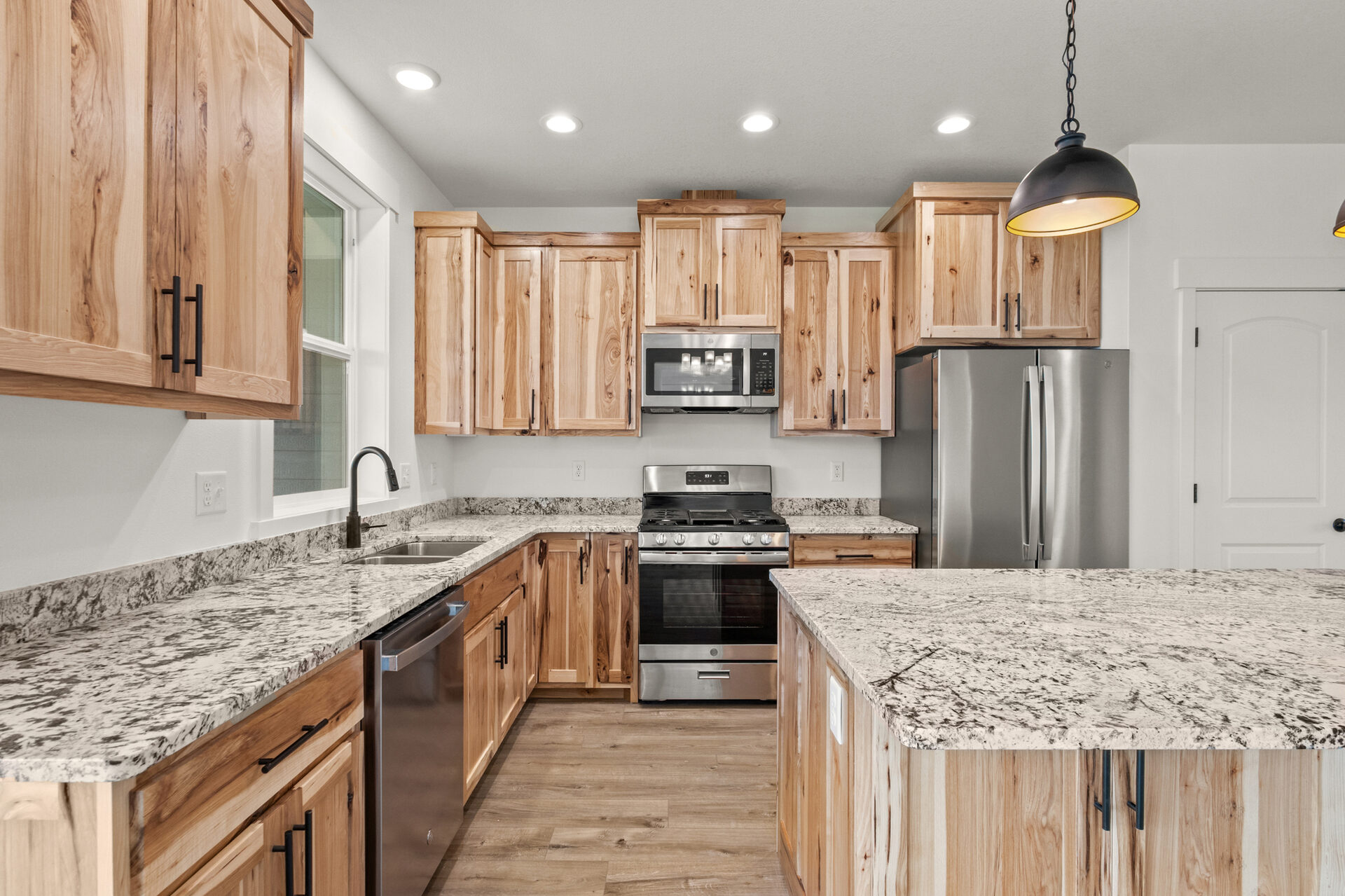 Kitchen stove and cabinets at 230 Stirling Loop