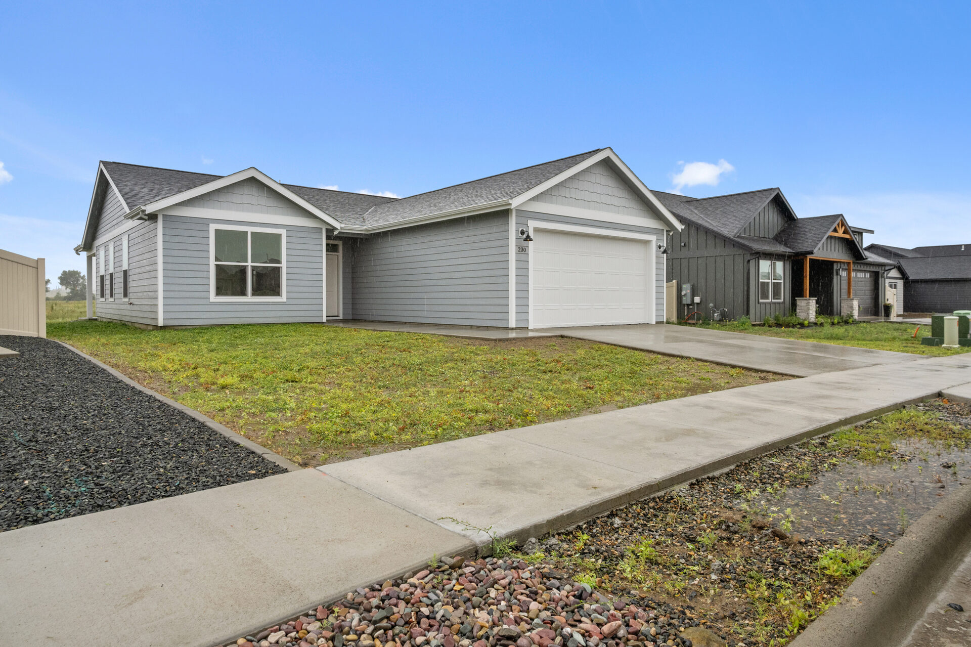 Front exterior of 230 Stirling Loop with driveway