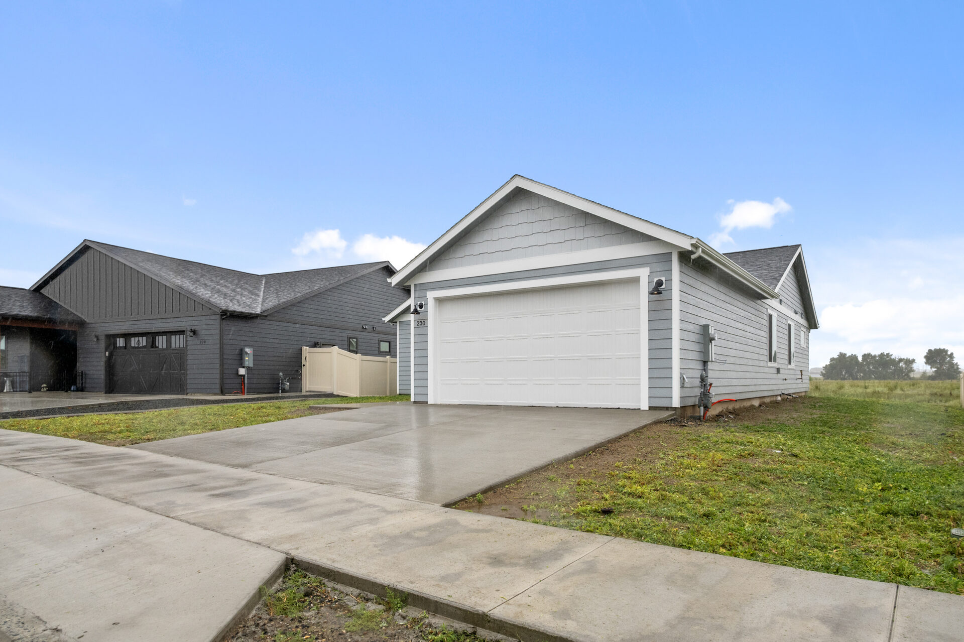 Side exterior of 230 Stirling Loop showing attached garage