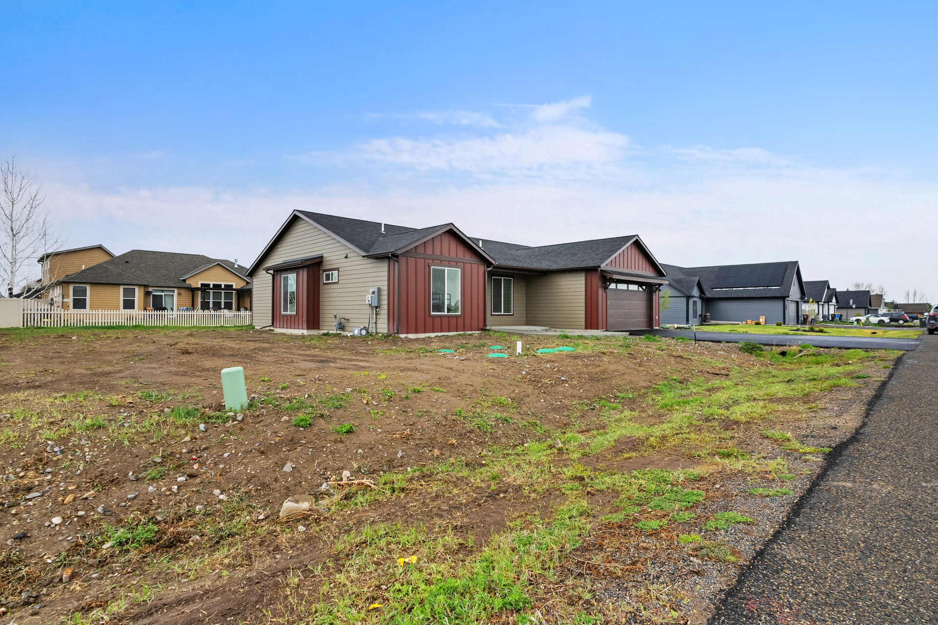 Front exterior with neighboring homes at 3814 Lovegrass Ln