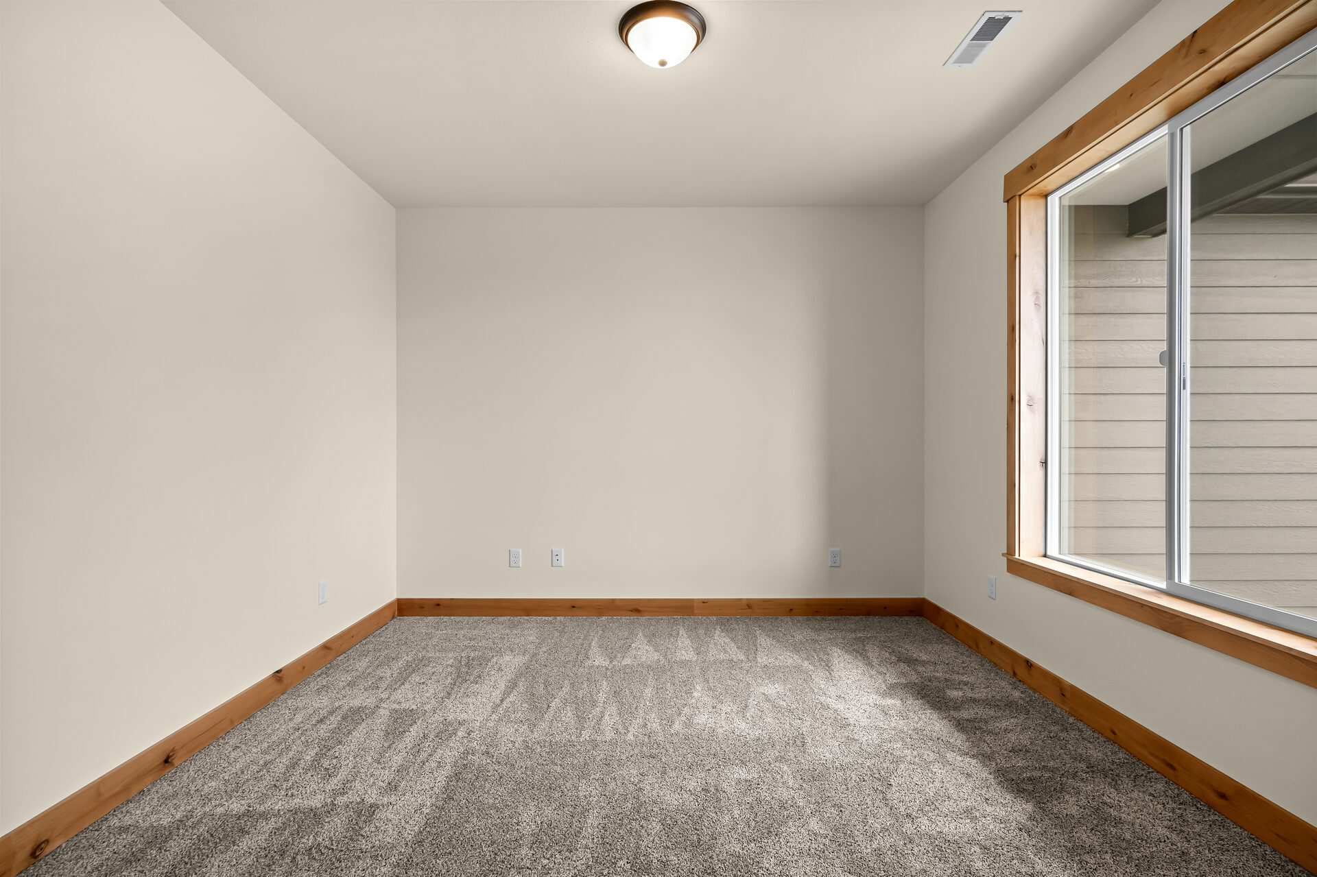 Secondary bedroom in a three bedroom, two bath Olin Homes home at 3814 Lovegrass Ln