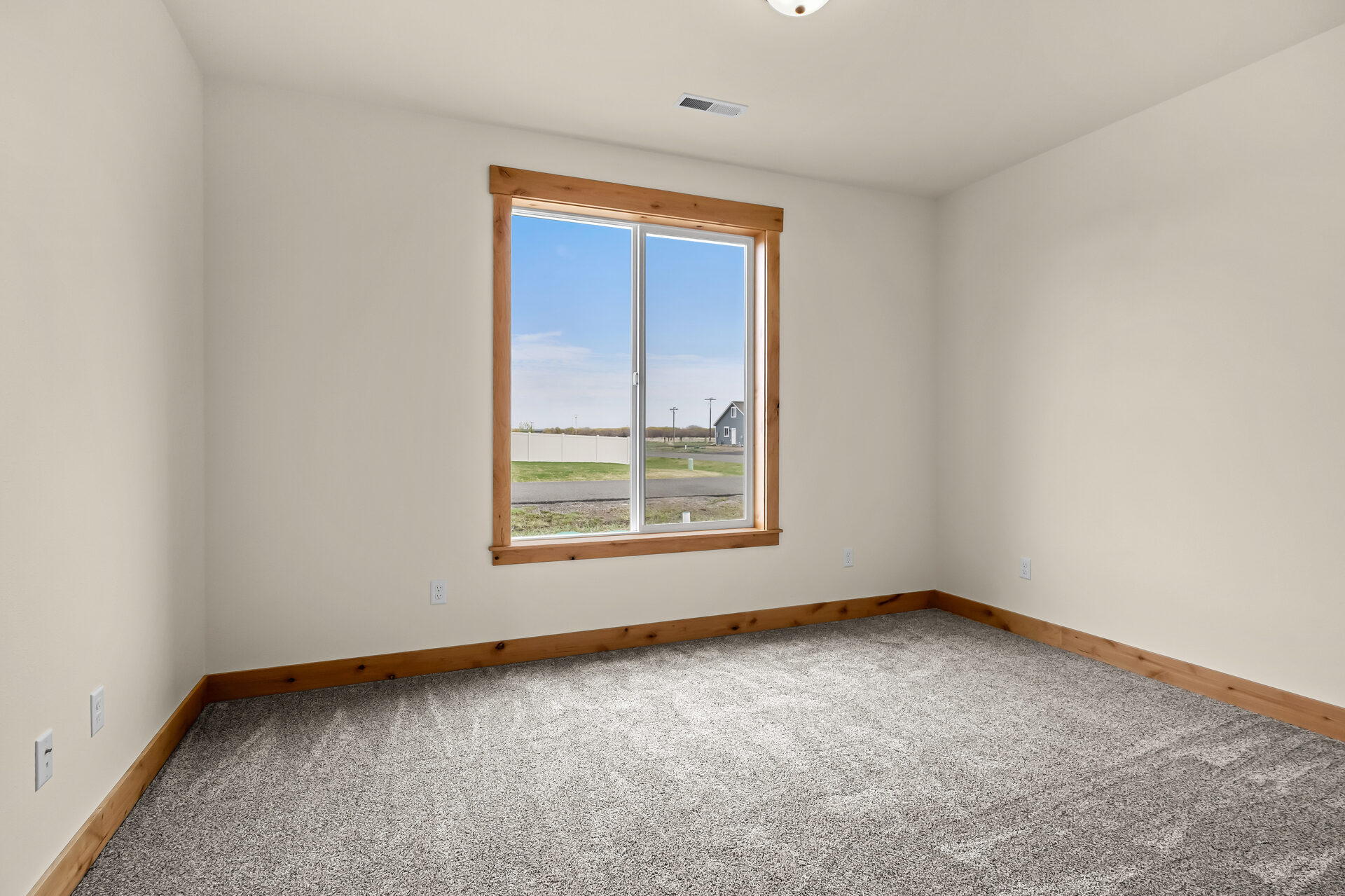 Secondary bedroom with window at 3814 Lovegrass Ln