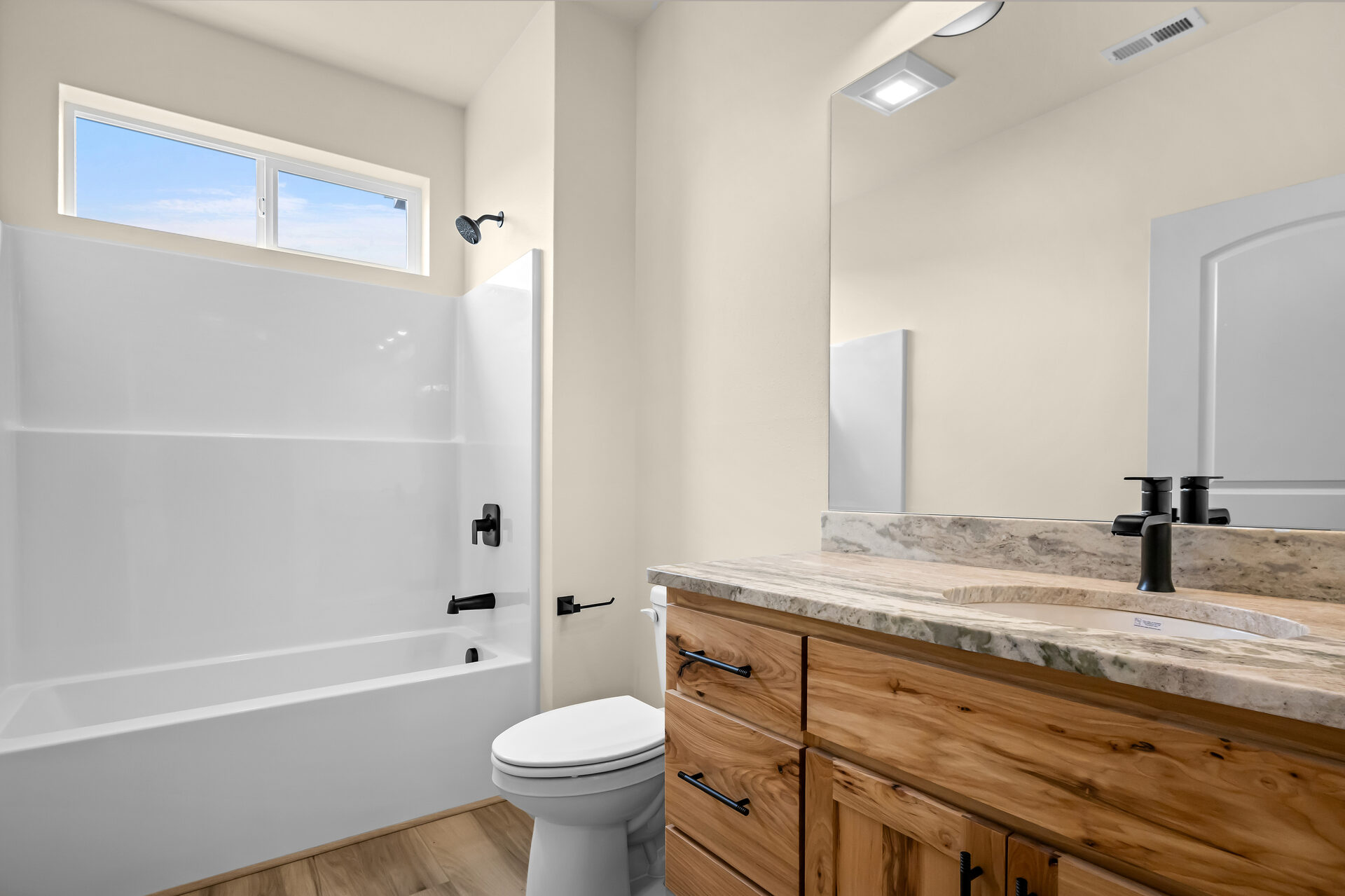 Guest bathroom in a three bedroom, two bath Olin Homes home at 3814 Lovegrass Ln