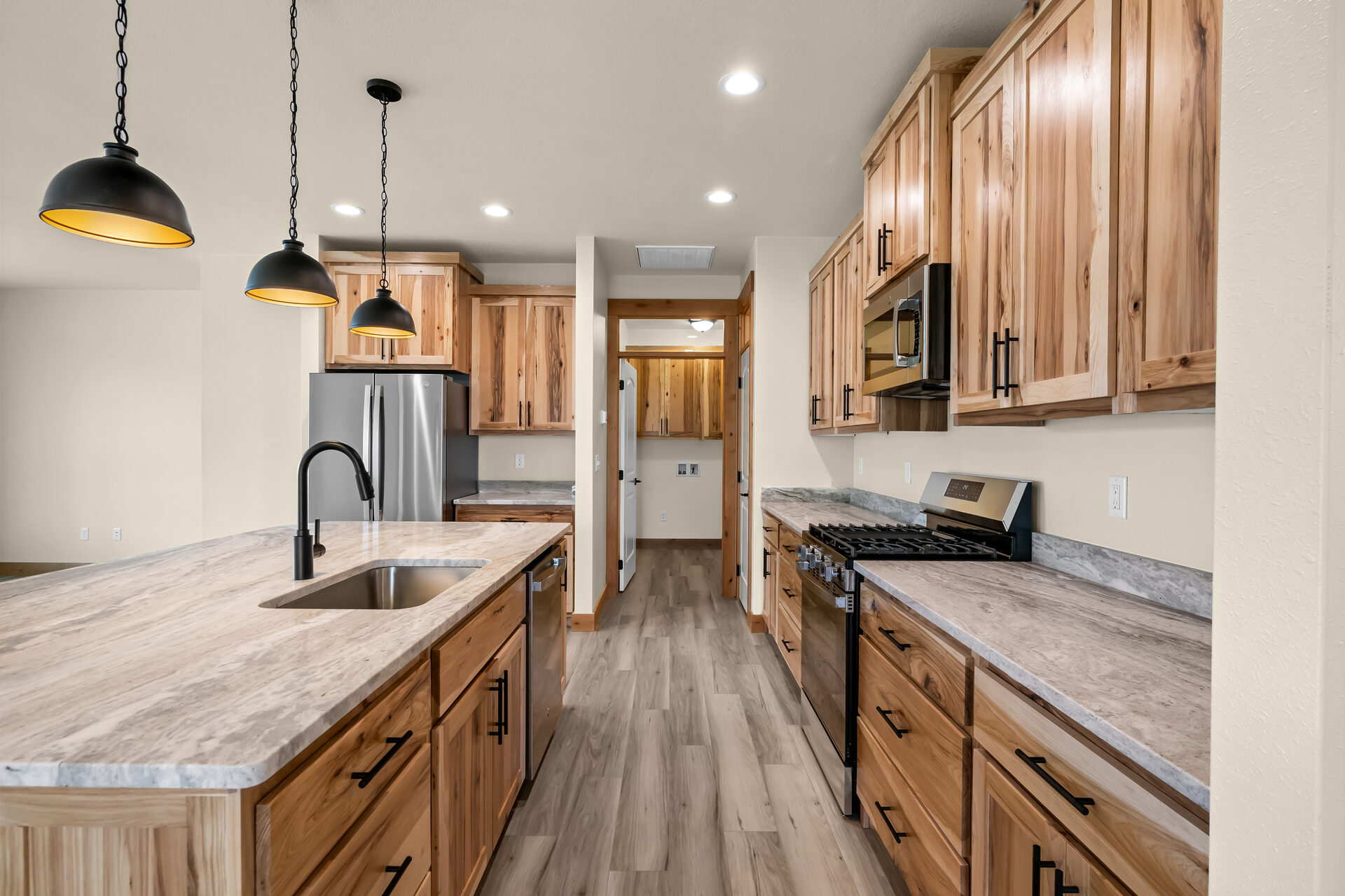 Kitchen with hickory cabinets and granite counters at 3814 Lovegrass Ln