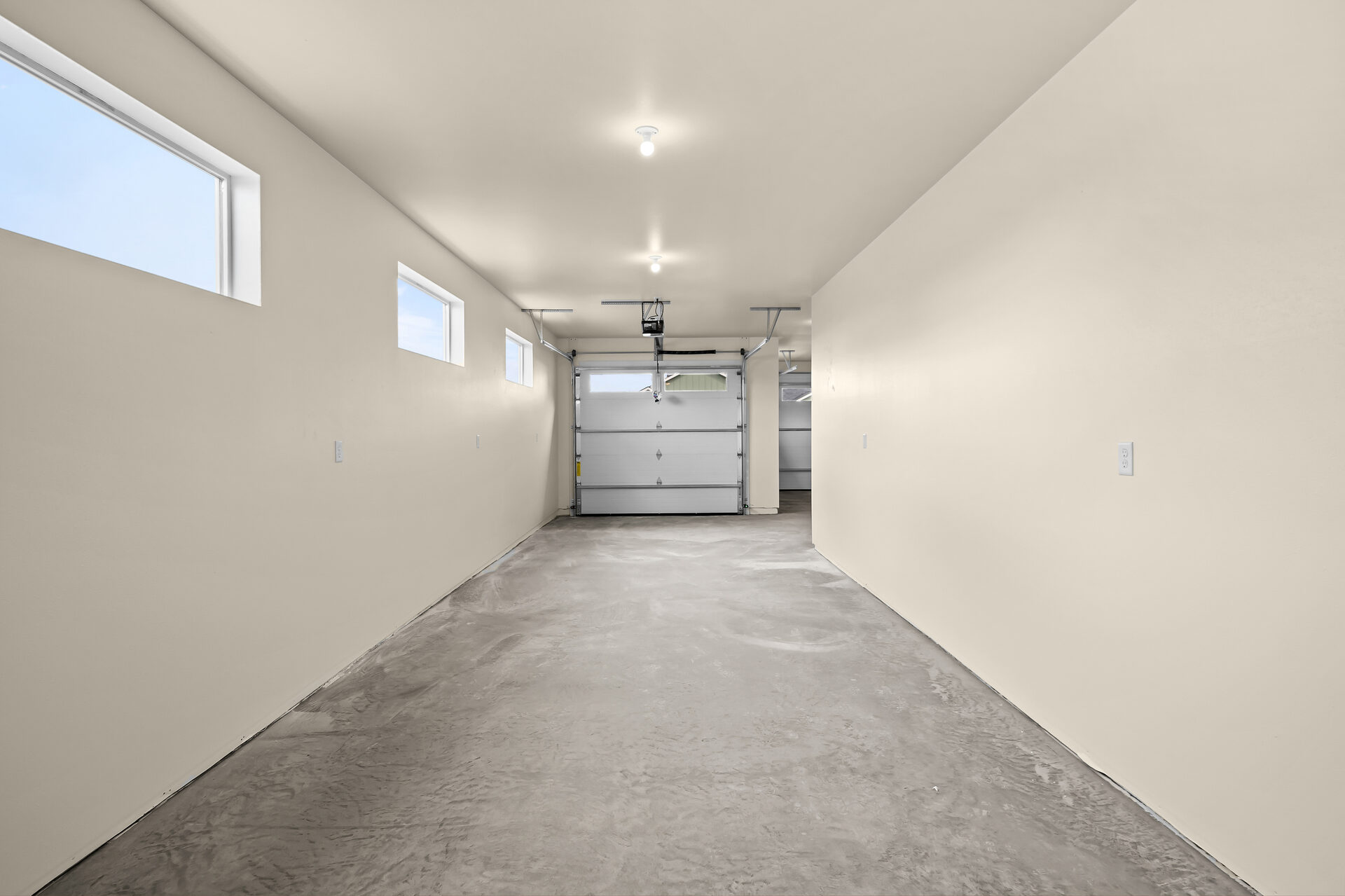Interior view of the three-car garage at 3814 Lovegrass Ln