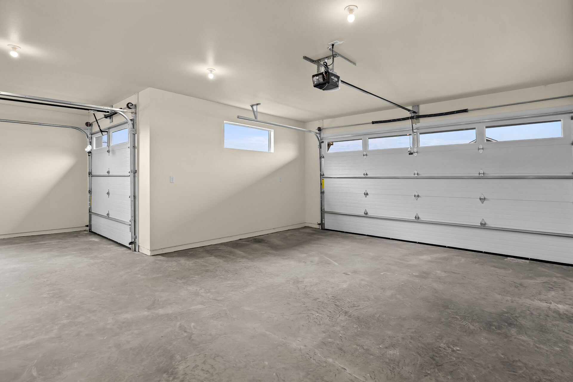 Garage with the door open at 3814 Lovegrass Ln