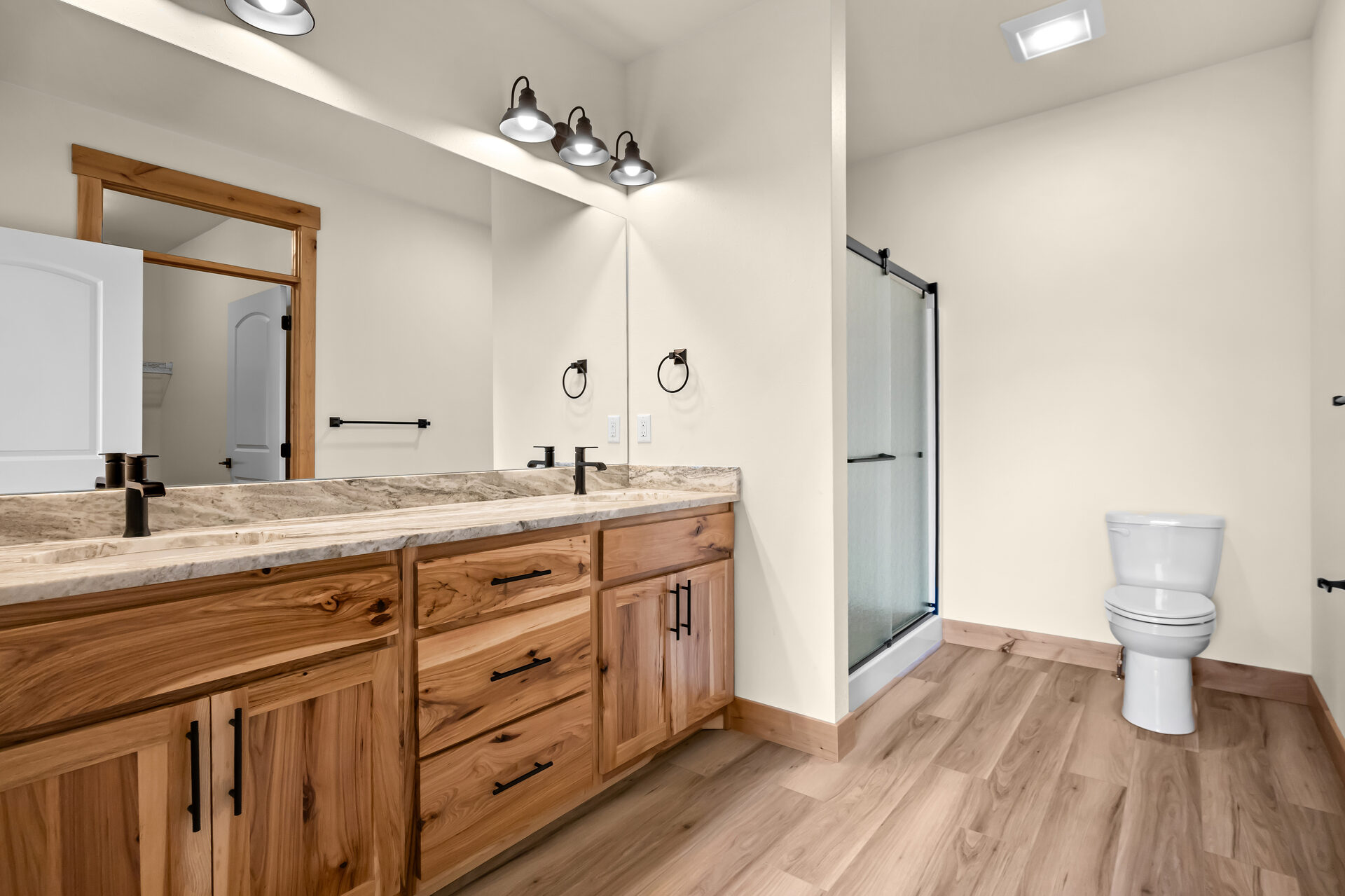 Primary bathroom walk-in shower and tub at 3814 Lovegrass Ln