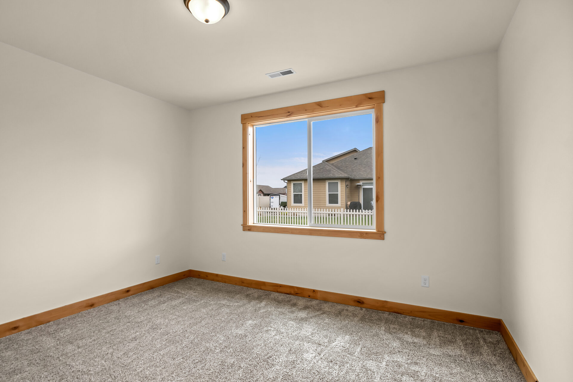 Secondary bedroom with window at 3814 Lovegrass Ln