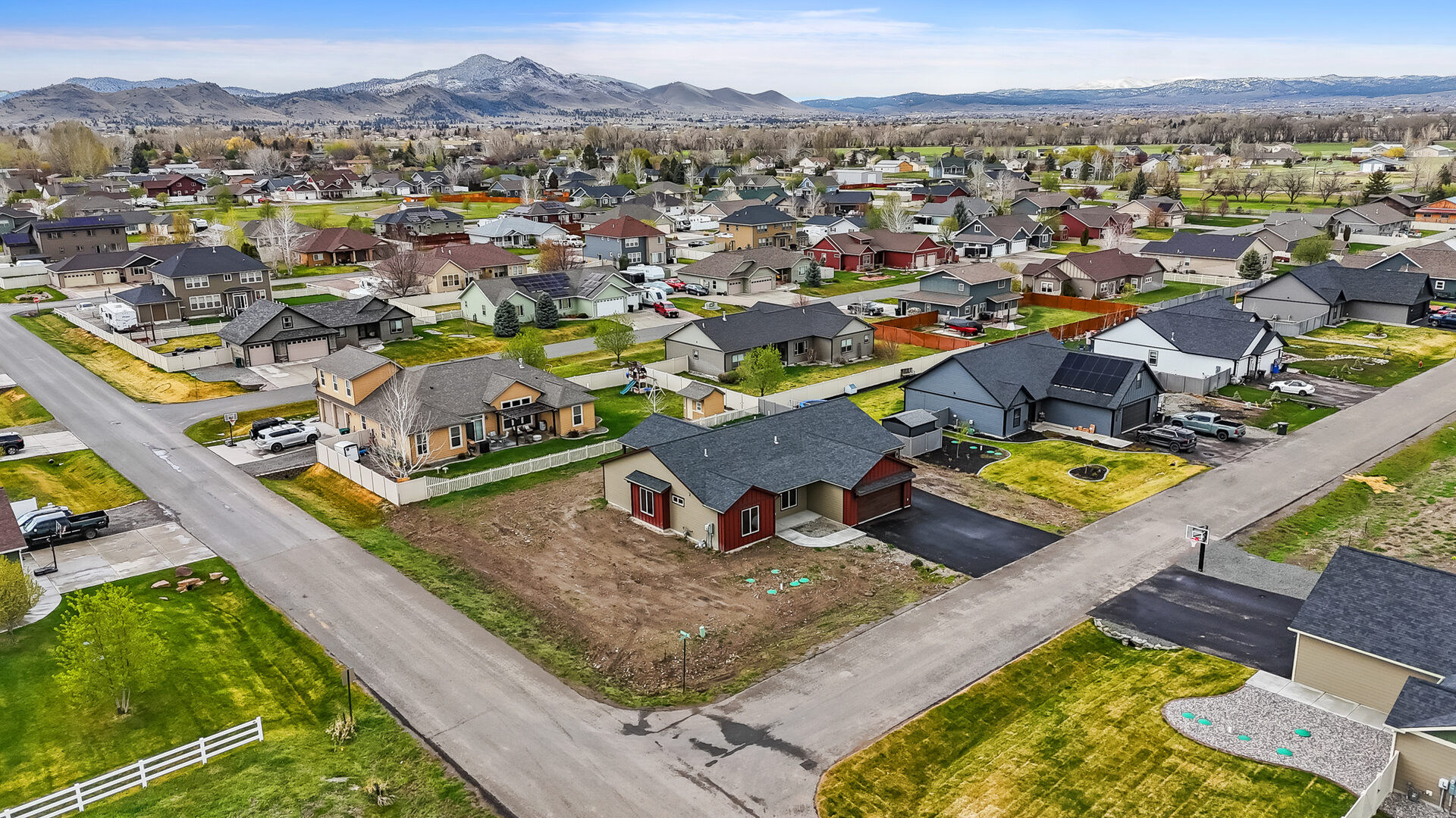 Aerial view of the neighborhood and mountains surrounding 3814 Lovegrass Ln