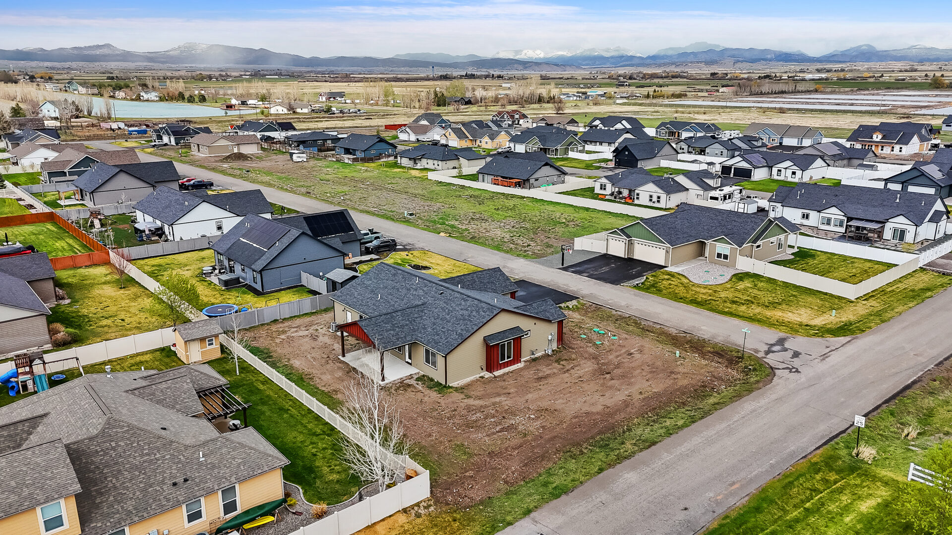 Aerial view of the backyard and covered patio at 3814 Lovegrass Ln