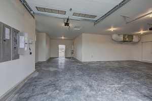 3 car garage with door to back yard